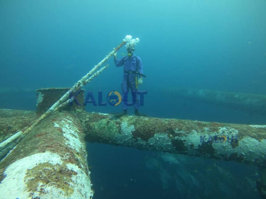 Industrial diver using advanced safety equipment